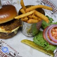 The Medic Burger · Served with lettuce, tomato, habanero ranch, onion, fried egg, cheese and topped with chili.