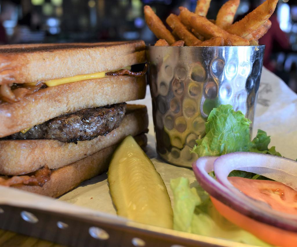 Gung Ho Burger · Let's star with a bacon grilled cheese sandwich, top that with our Angus burger, lettuce, tomato and onion then finished off with another bacon grilled cheese sandwich. It's mouth full!