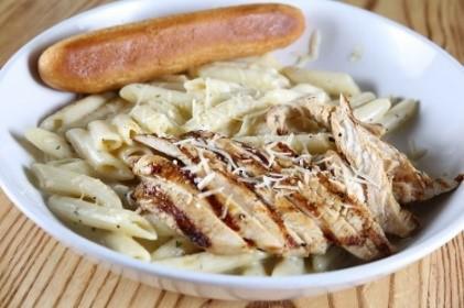 Allied Chicken Penne Pasta · A heaping bowl of penne pasta tossed in our creamy Alfredo sauce with fresh broccoli. Topped with a grilled or blackened chicken breast and Parmesan cheese. Served with a side salad and garlic toast.