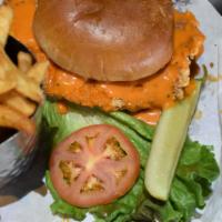 Carmen Miranda · A plump chicken breast grilled to perfection, tossed in a spicy Buffalo sauce and topped wit...