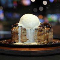 Bread pudding · Our own, house made bread pudfding served with sweet bourbon sauce and topped with ice cream.