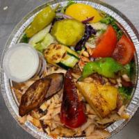 Doner Kebab Full-Size Meal · Gourmet large Doner plate with yellow rice or fries, fresh and roasted vegetables, sauces on...