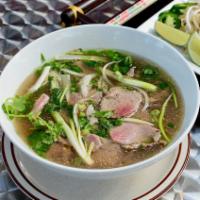 N6. Rare Steak & Brisket Pho · Rare steak and brisket only served with beef broth. Comes with green and white onions, peppe...