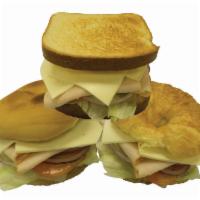 Turkey Sandwich · Poultry sandwich. Choice of croissant, bagel or toast. Items come with sandwich, lettuce, to...