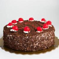 Black Forest · Chocolate cake with custard cream filling and bing cherries. Decorated with fresh whipping c...