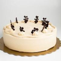 Mocha Cake · Vanilla sponge cake layered with fresh mocha whipping cream. Decorated with chocolate tags.