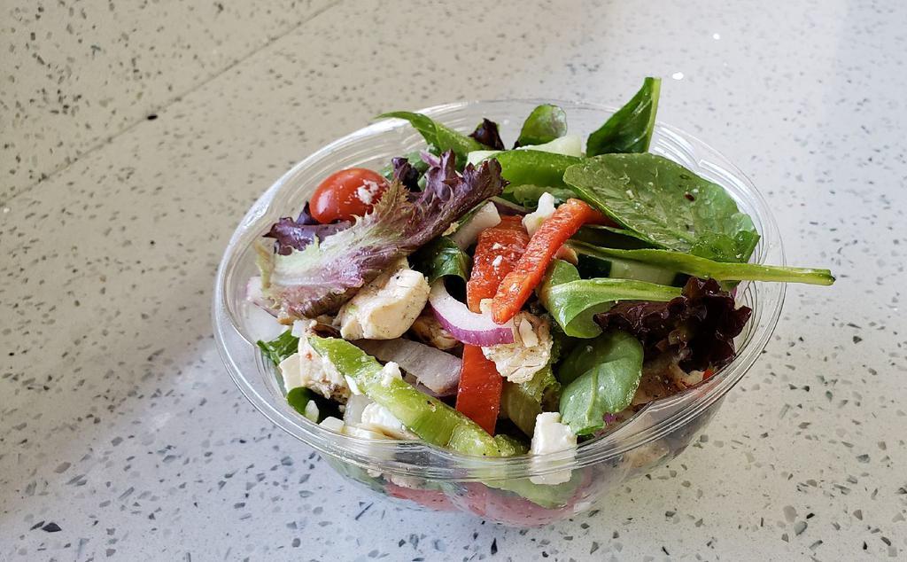 Greek Escape Salad · Romaine or mixed greens, cherry tomatoes, cucumber, peppers, red onions, feta cheese and olives topped with olive oil.