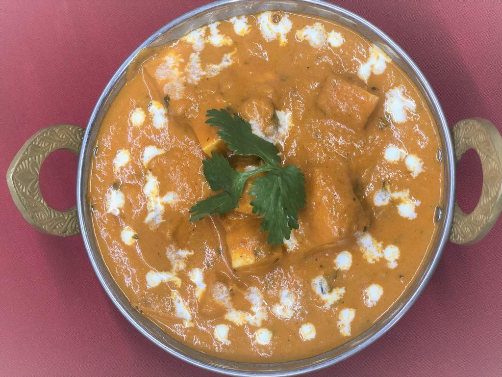 Paneer Tikka Masala · Cottage cheese cubes, bell pepper, onion, and tomatoes cooked in a kadai with chefs special sauce.