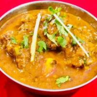 Desi Chicken · Chicken pieces cooked in traditional Indian style.