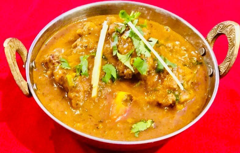 Desi Chicken · Chicken pieces cooked in traditional Indian style.