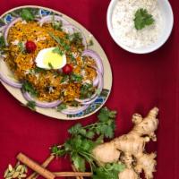 Kashmiri Vegetable Biryani · Basmati rice cooked with seasonal vegetables and Indian herbs with raita.