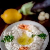 Baba Ghanoush · Customer favorite. Roasted eggplant with tahini sauce, garlic, lemon juice and sprinkled wit...