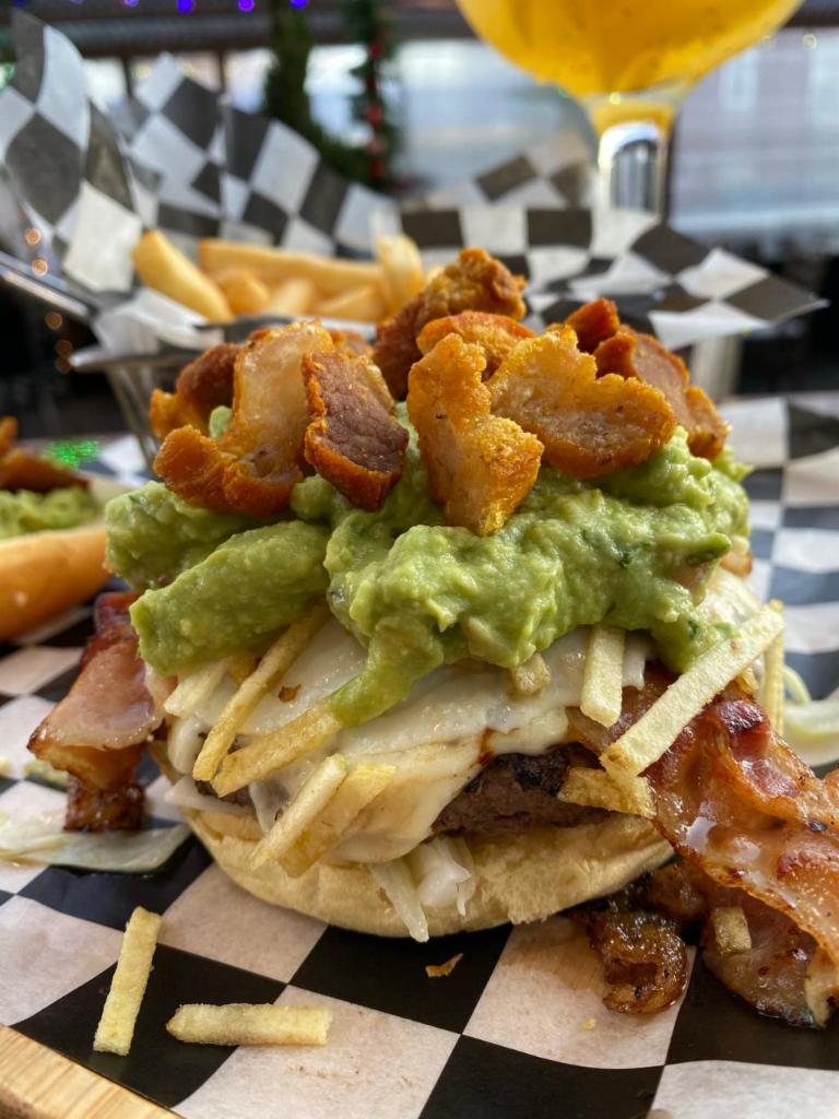 Super Burger · 8oz 100% prime angus beef, cheese, bacon, fried egg, guacamole, fried pork belly, lettuce tomatoe and onions 