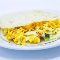 Arepa Rellena · Stuffed cake with Colombian style eggs.
