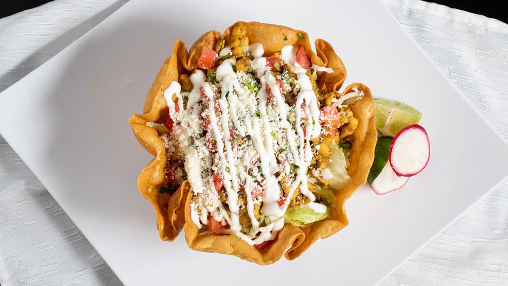 Taco Salad · Your choice of classic meat served in a deep-fried flour tortilla with beans, lettuce, pico de gallo, Cotija cheese and sour cream.