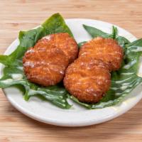 Deep-Fried Chinese Pumpkin Cakes · Served with condensed milk.