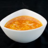 Egg Flower Soup · Beaten egg with corn and carrot in chicken broth.