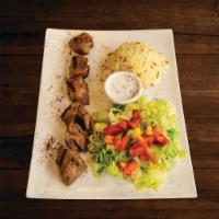 Lamb Shish Kebab Plate · Char grilled skewer of marinated lamb cubes. Served with pita bread, salad and rice.