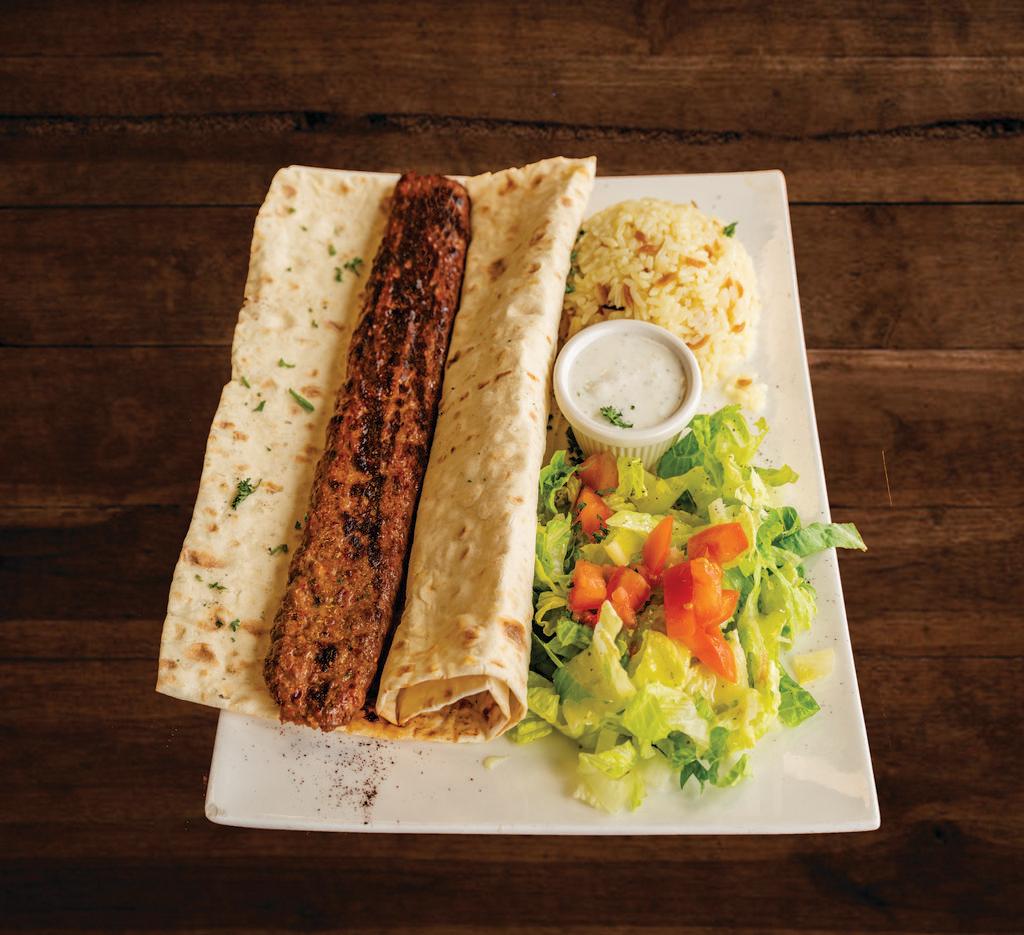 Adana Kebab Plate · Served with lavash bread. Charcoal grilled minced lamb with parsley, red onions and spices. Served with lavash, salad and rice.