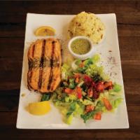 Salmon Plate · Fresh salmon flavored with garlic, lemon and black pepper. Served with pita bread, salad and...