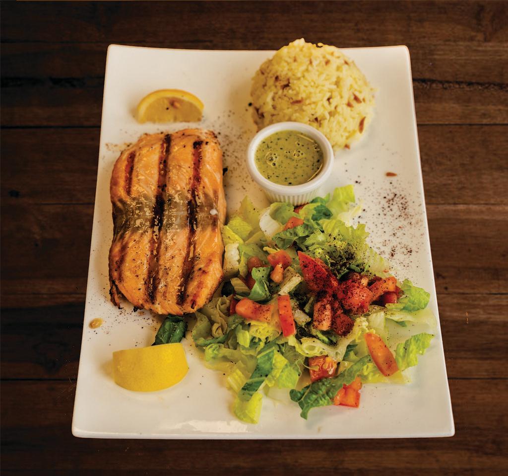 Salmon Plate · Fresh salmon flavored with garlic, lemon and black pepper. Served with pita bread, salad and rice.