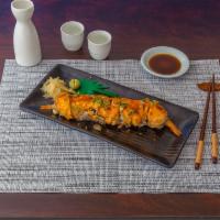 House Roll · Shrimp tempura, crab, avocado, cucumber, salmon special mayo sauce.