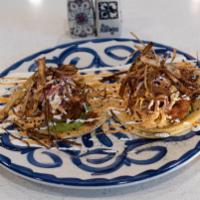 Tacos Baja · Beer battered fish or shrimp, on a corn tortilla, topped with house coleslaw, fried leeks, b...
