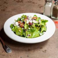 Spinach Salad · Fresh spinach tossed with dried cranberries, goat cheese, candied pecans, and balsamic vinai...