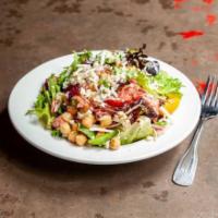 Chop Salad · Garbanzos, braised chicken, salami, mozzarella, red onions, green peppers, tomato and raspbe...