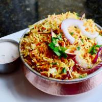 Vegetable Biryani · Rice cooked with vegetable and aromatic spices.