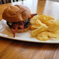 Bacon Bleu Burger · Grilled to order burger topped with bleu cheese crumbles, bacon, red wine caramelized onions...