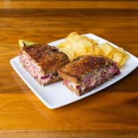 Reuben Sandwich · Slow roasted in-house corn beef brisket shaved thin and steeped with our own seasoned sauerk...