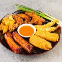 Double Assorted Appetizer · 2 ribs, 2 egg rolls, 4 crabmeat pastries, 4 chicken wings and 2 fried shrimp.