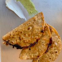 Cheesy Beef Tacos (3) · This order contains 3 cheesy beef tacos, pan seared to cheesy perfection, served with white ...