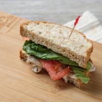 Roasted Turkey Sandwich · Includes mayonnaise, spicy mustard, tomato, lettuce and red onion on 9 grain. 