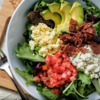 Cobb Salad · Mixed greens, bleu cheese crumbles, bacon, diced egg, tomato, parsley and avocado with sesam...