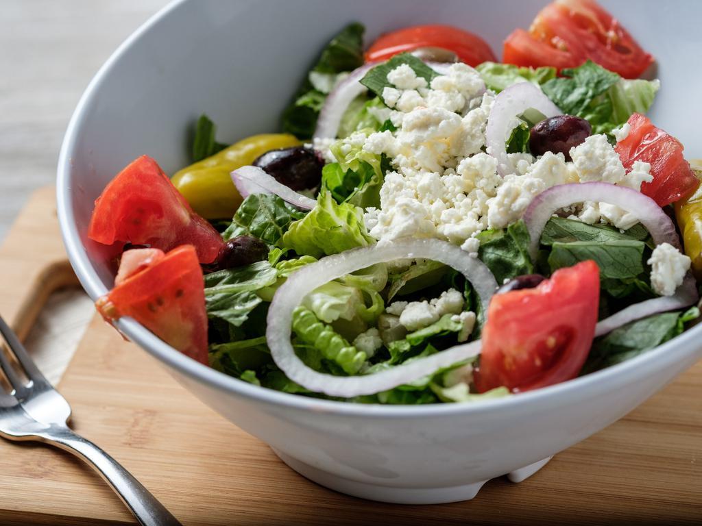Greek Salad · Romaine, feta, pepperoncini, Kalamata olives, red onion, tomato and Greek dressing.