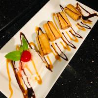 Fried banana with Coconut Ice cream · One scoop coconut ice cream with 4  Fried banana