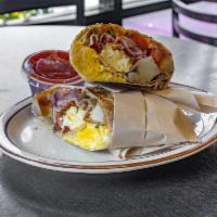 Fiesta Breakfast Burrito · 3 eggs, ham, bacon, jalapeno, tomato, onion, cheese and potato.