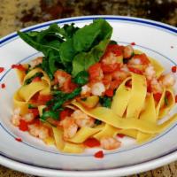 Pappardelle alla Giulio · Fresh wide fettuccine with sauteed shrimp, arugula in a fresh tomato, and white wine sauce. ...