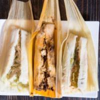 The hungry box · The hungry box Contains 3 Tamales (mole with chicken, salsas with chicken, rajas con queso)