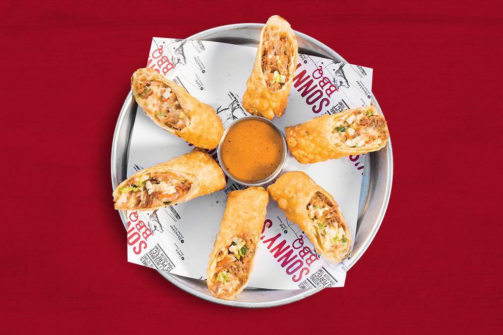 Redneck Egg Rolls · Loaded with pulled pork, homemade coleslaw and pepper jack cheese with a side of smokey ranch dip.
