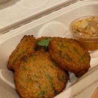 Fish Cake · 5 pieces. Thai fish cakes marinated with our red curry served with sweet & chili sauce toppe...