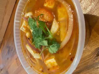 Small Tom Yum Soup · Hot and sour soup. Hot and sour lemongrass soup with mushrooms, tomatoes, onions and topped with galangal and cilantro.