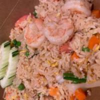House Fried Rice · Jasmine rice stir-fried with an egg, garlic, green onions, peas, carrots, tomatoes and onions.