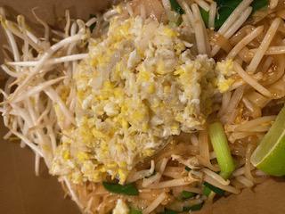 Crab Pad Thai · Rice vermicelli stir-fried in tamarind sauce with an egg, crab meat, bean sprouts, green onions, crushed peanut aside and a wedge of lime.