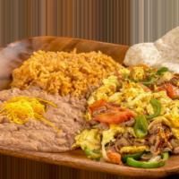 Machaca Plate · Egg and shredded beef scramble with onion, bell pepper, and tomato.