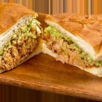 Chicken Torta · Shredded chicken in red sauce, guacamole, and lettuce.