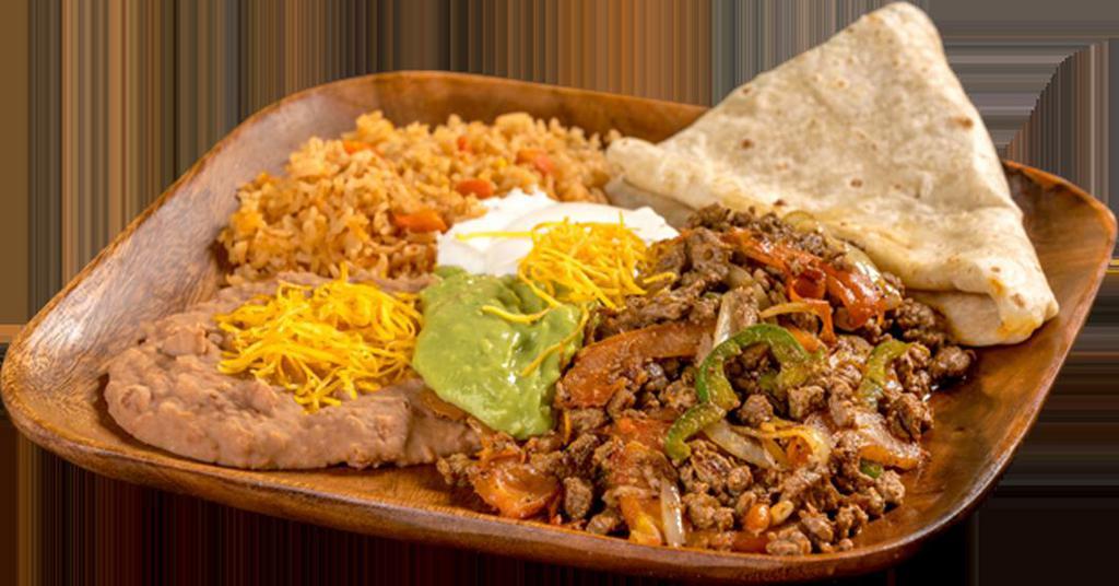 4. Fajita Platter · Chicken or steak mixed with onion, bell pepper, and tomato, topped with guacamole and sour cream.