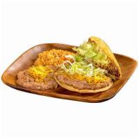 7. Tostada and Taco Platter · 1 bean tostada and 1 shredded beef taco.